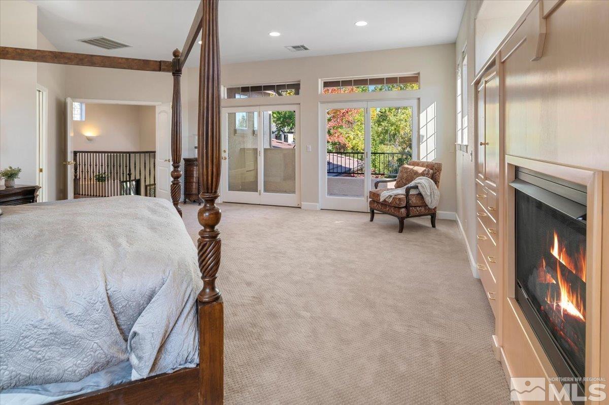 14235 Powder River Court Reno, NV 89511 - Photo 19 of 40 a bed room with a bed and a large window