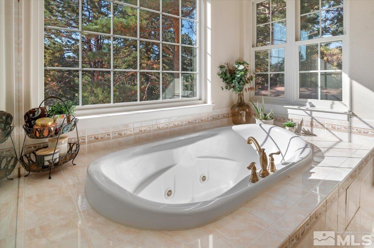 14235 Powder River Court Reno, NV 89511 - Photo 23 of 40 a bath tub sitting next to a window