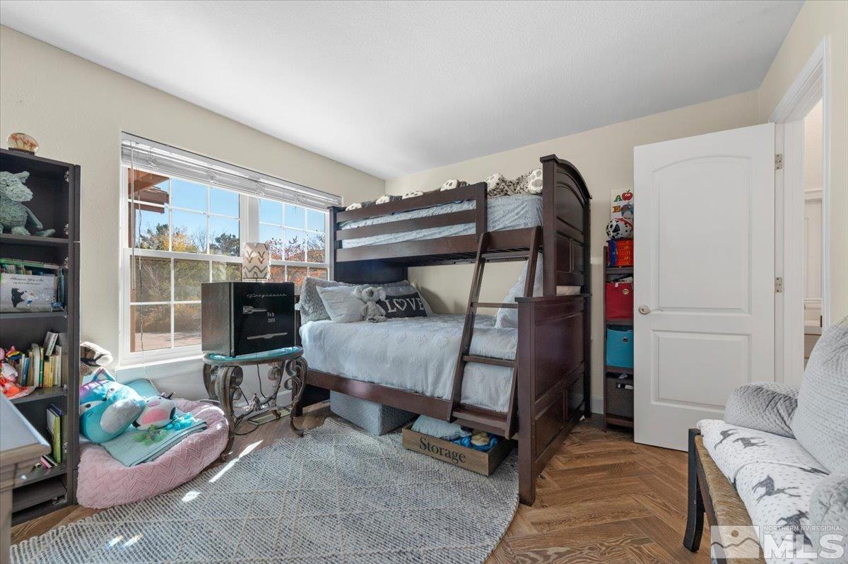 14235 Powder River Court Reno, NV 89511 - Photo 24 of 40 a bedroom with furniture and a window