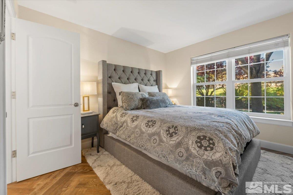 14235 Powder River Court Reno, NV 89511 - Photo 26 of 40 a bedroom with a large bed and a window