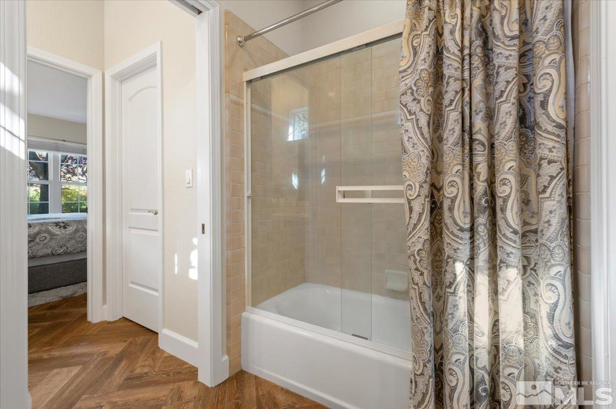 14235 Powder River Court Reno, NV 89511 - Photo 27 of 40 a bathroom with a bathtub and a shower