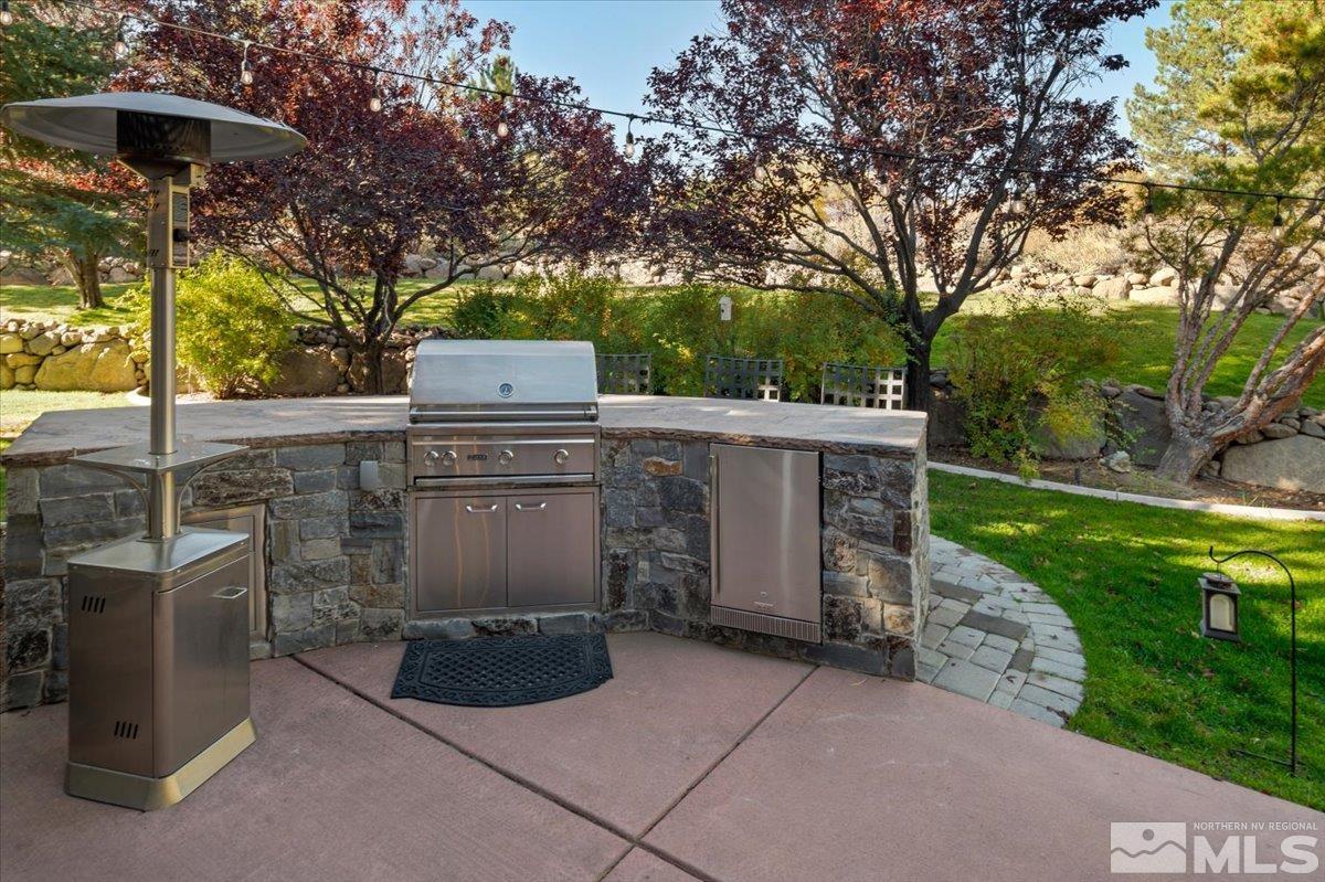 14235 Powder River Court Reno, NV 89511 - Photo 28 of 40 a front view of a house with garden