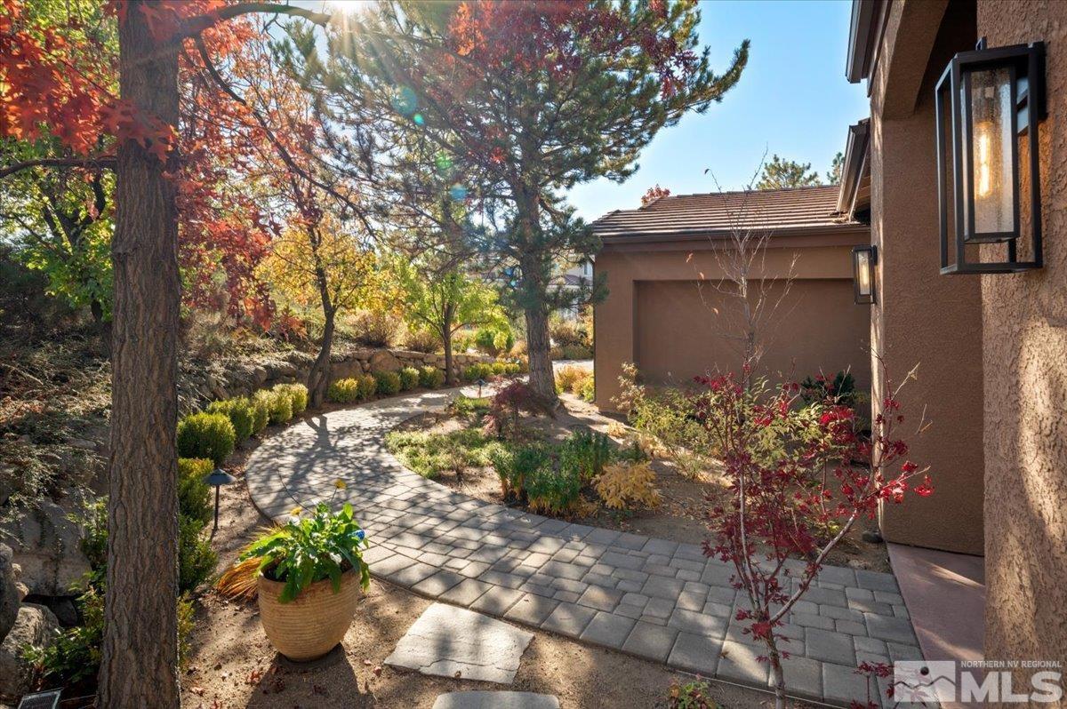 14235 Powder River Court Reno, NV 89511 - Photo 4 of 40 a front view of a house with a yard