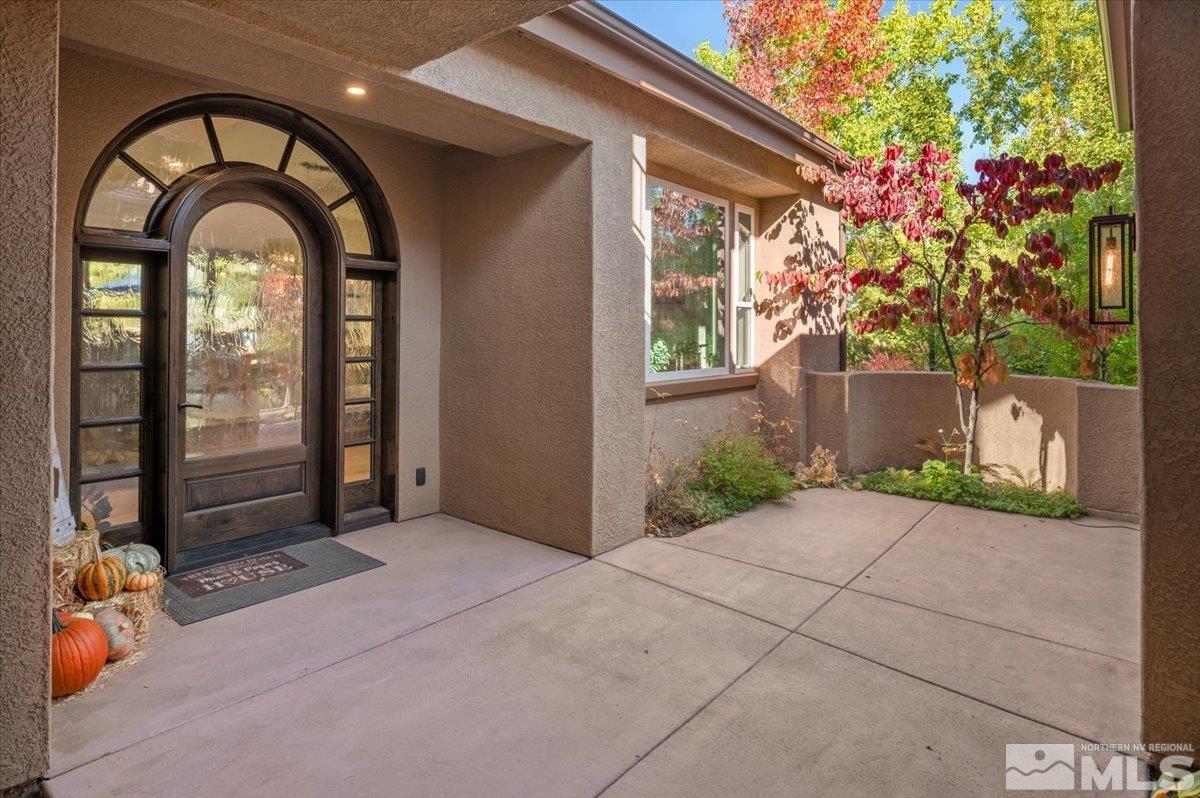 14235 Powder River Court Reno, NV 89511 - Photo 6 of 40 a front view of a house with garden