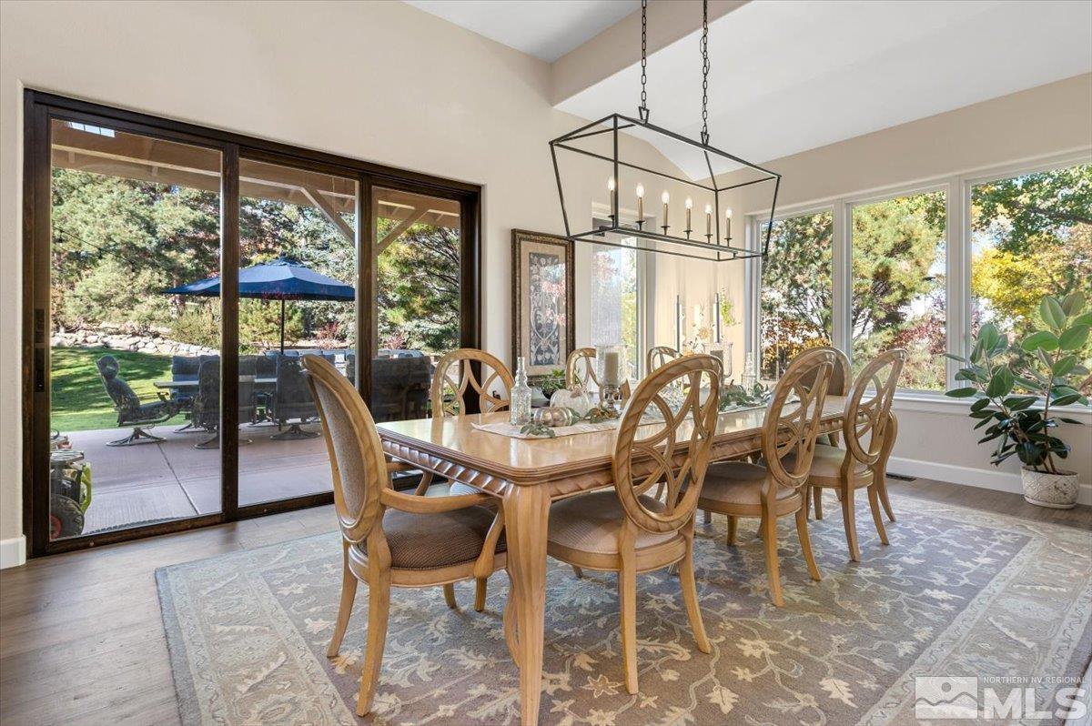 14235 Powder River Court Reno, NV 89511 - Photo 10 of 40 a view of a dining room with furniture window and outside view