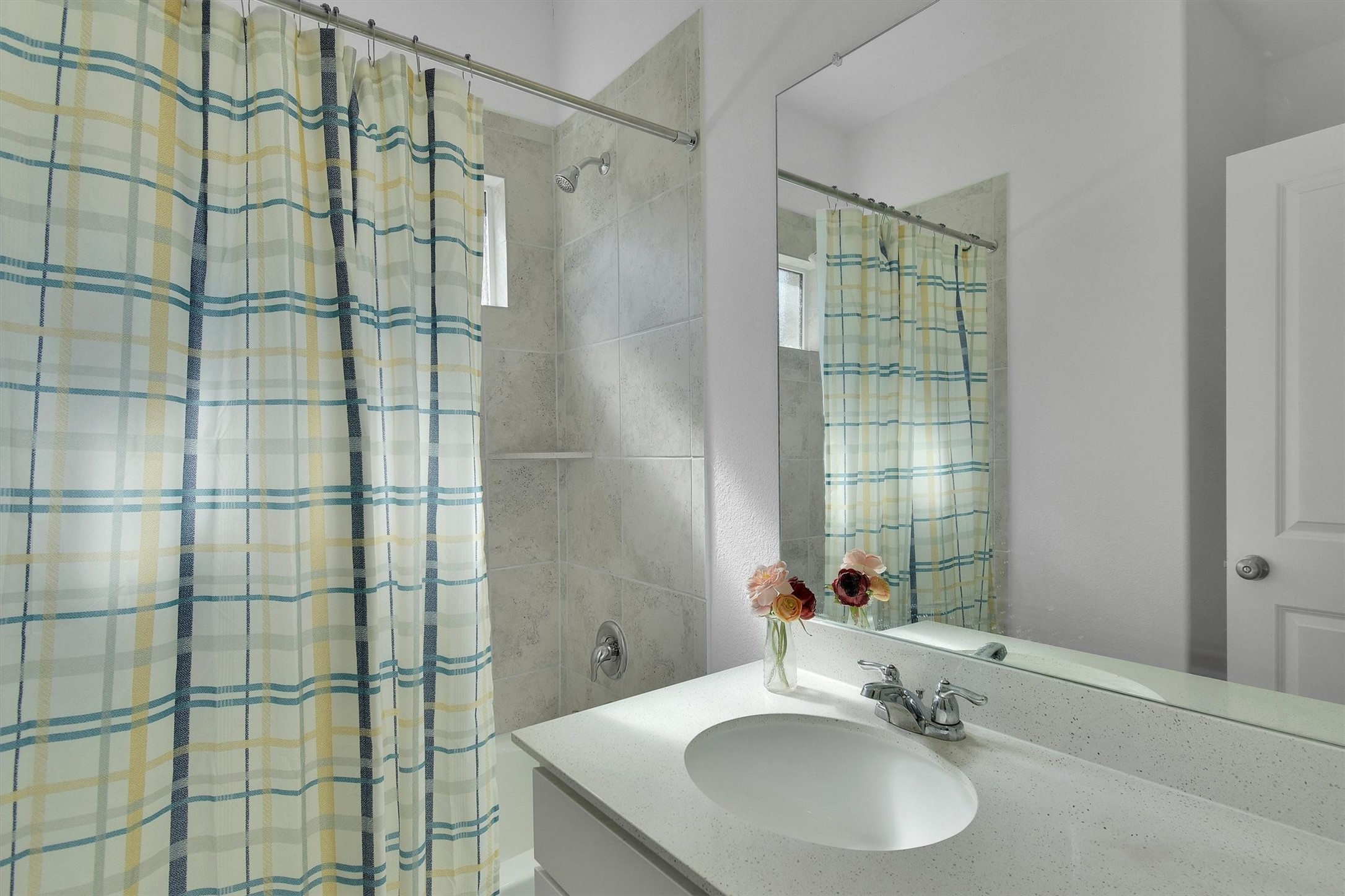 1621 Brueggerhoff Road Leander, TX 78641 - Photo 20 of 28 Bathroom with vanity and shower / bath combo with shower curtain