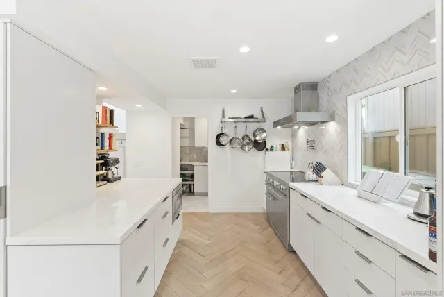 a spacious bedroom with a bed and a couch