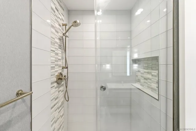 a bathroom with a bathtub and a shower