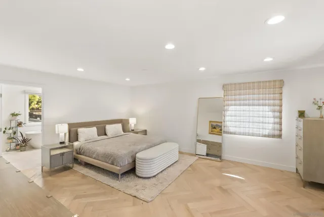 a bathroom with a double vanity sink mirror and shower