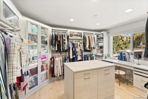 a view of room with workspace and windows