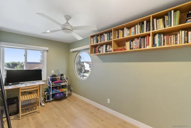 a side view of a house with a balcony