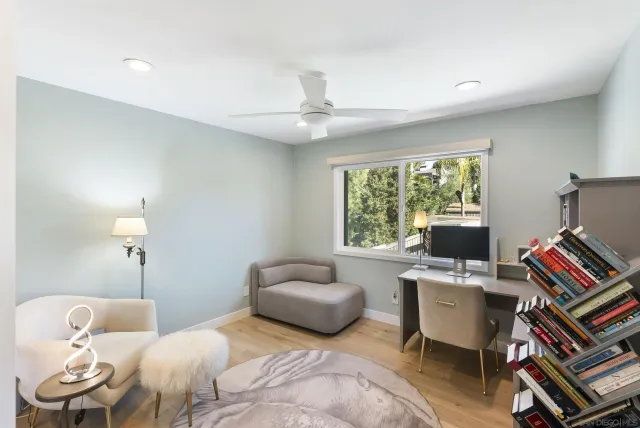 a view of a patio with a dining table and chairs with wooden floor