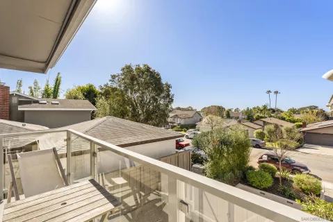 a view of a backyard with wooden fence
