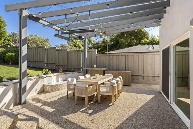 a view of roof deck with patio