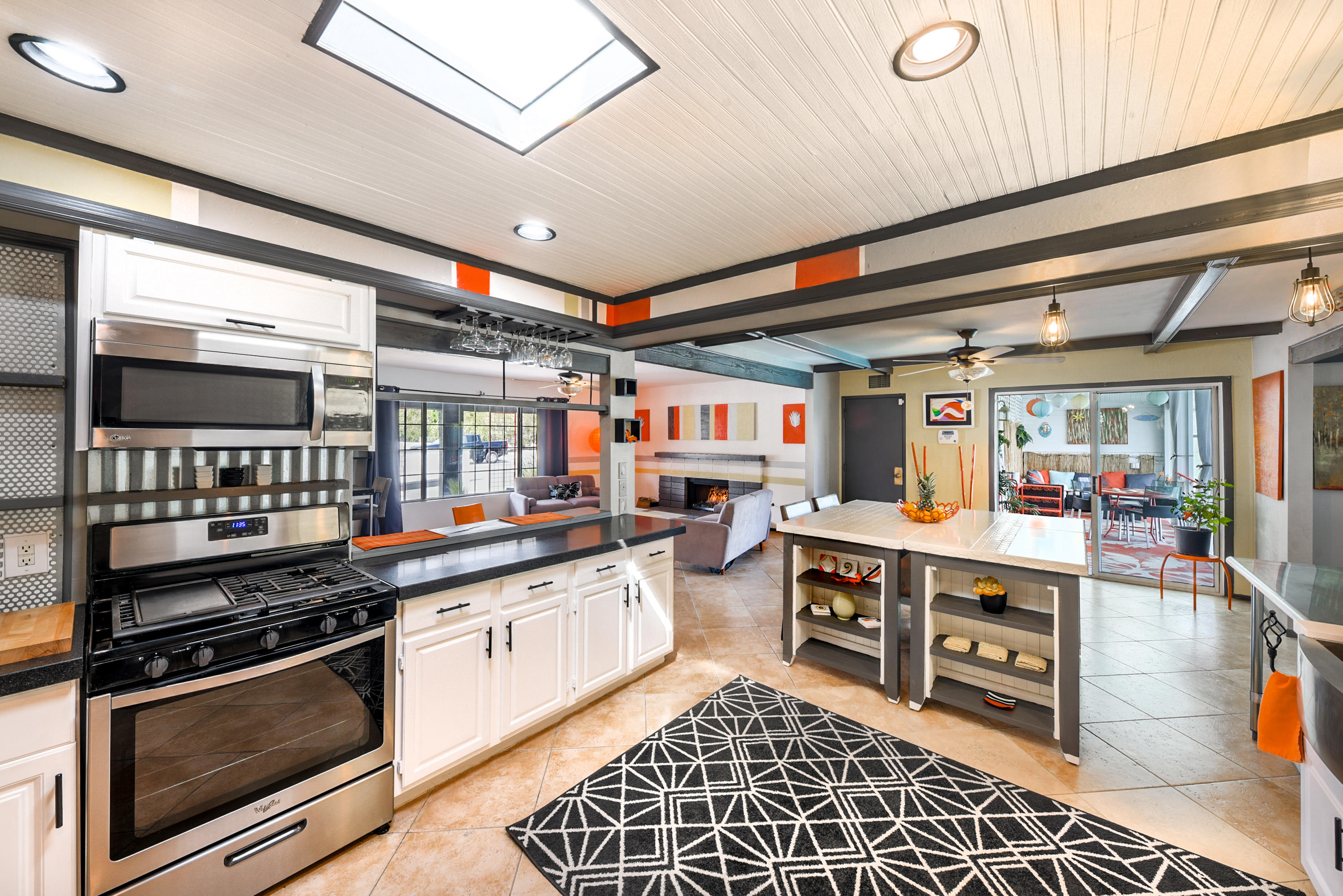 2306 Acacia Road East Palm Springs, CA 92262 - Photo 11 of 37 a kitchen with stainless steel appliances granite countertop a stove a sink and a microwave