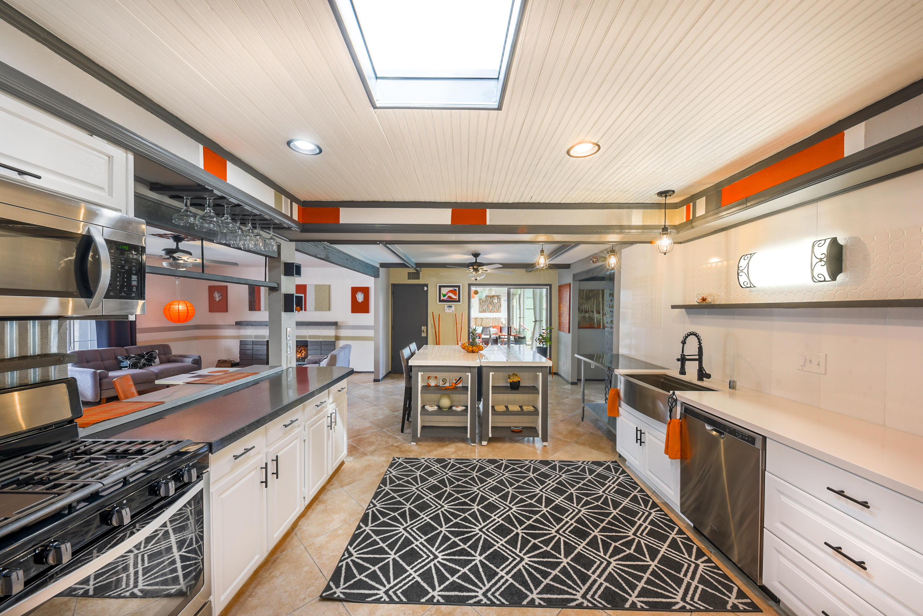 2306 Acacia Road East Palm Springs, CA 92262 - Photo 12 of 37 a kitchen with stainless steel appliances granite countertop a sink and cabinets