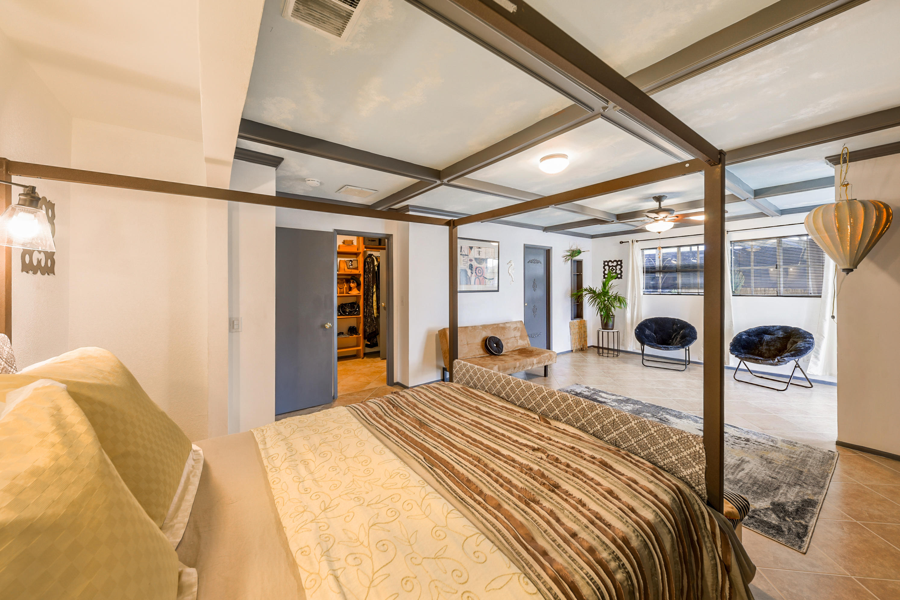 2306 Acacia Road East Palm Springs, CA 92262 - Photo 24 of 37 a bedroom with a bed and a large window