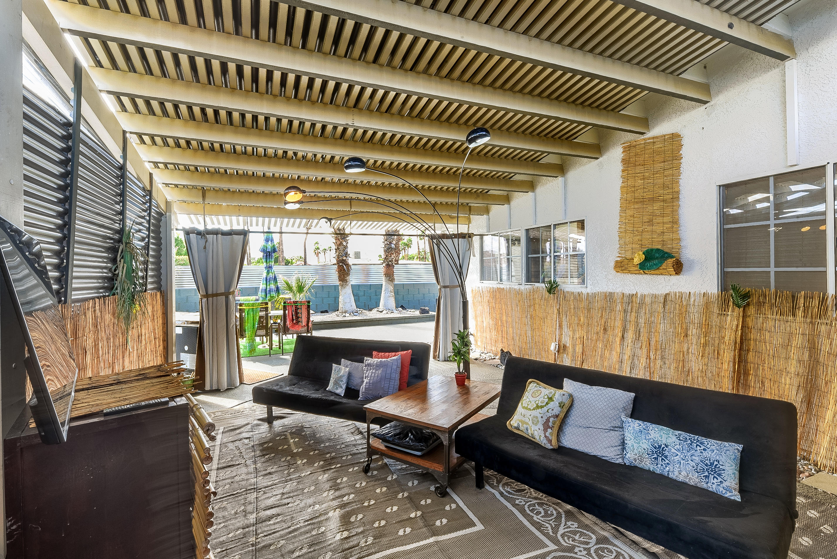 2306 Acacia Road East Palm Springs, CA 92262 - Photo 35 of 37 a living room with furniture and a fireplace