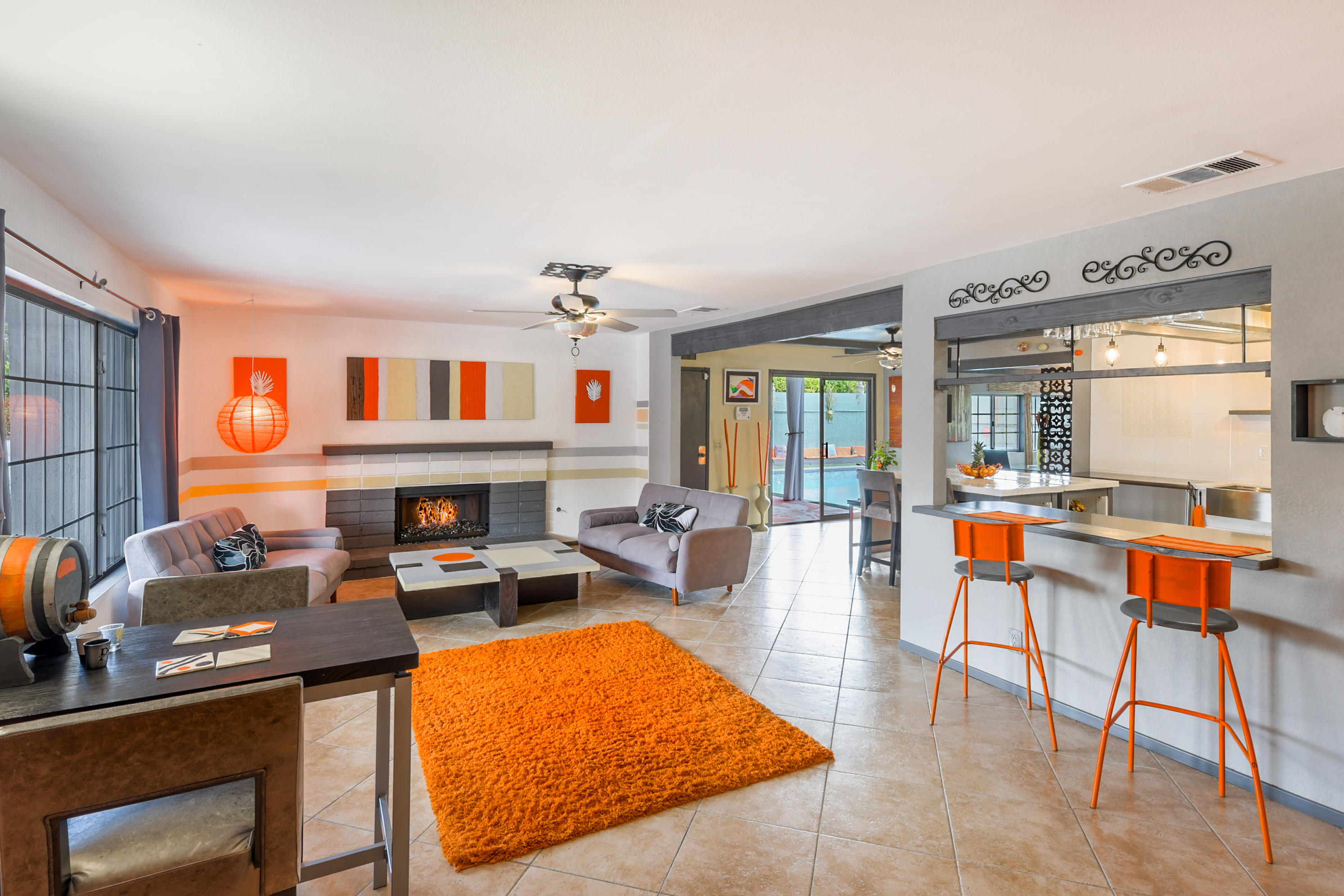 2306 Acacia Road East Palm Springs, CA 92262 - Photo 8 of 37 a room with furniture a flat screen tv and a fireplace