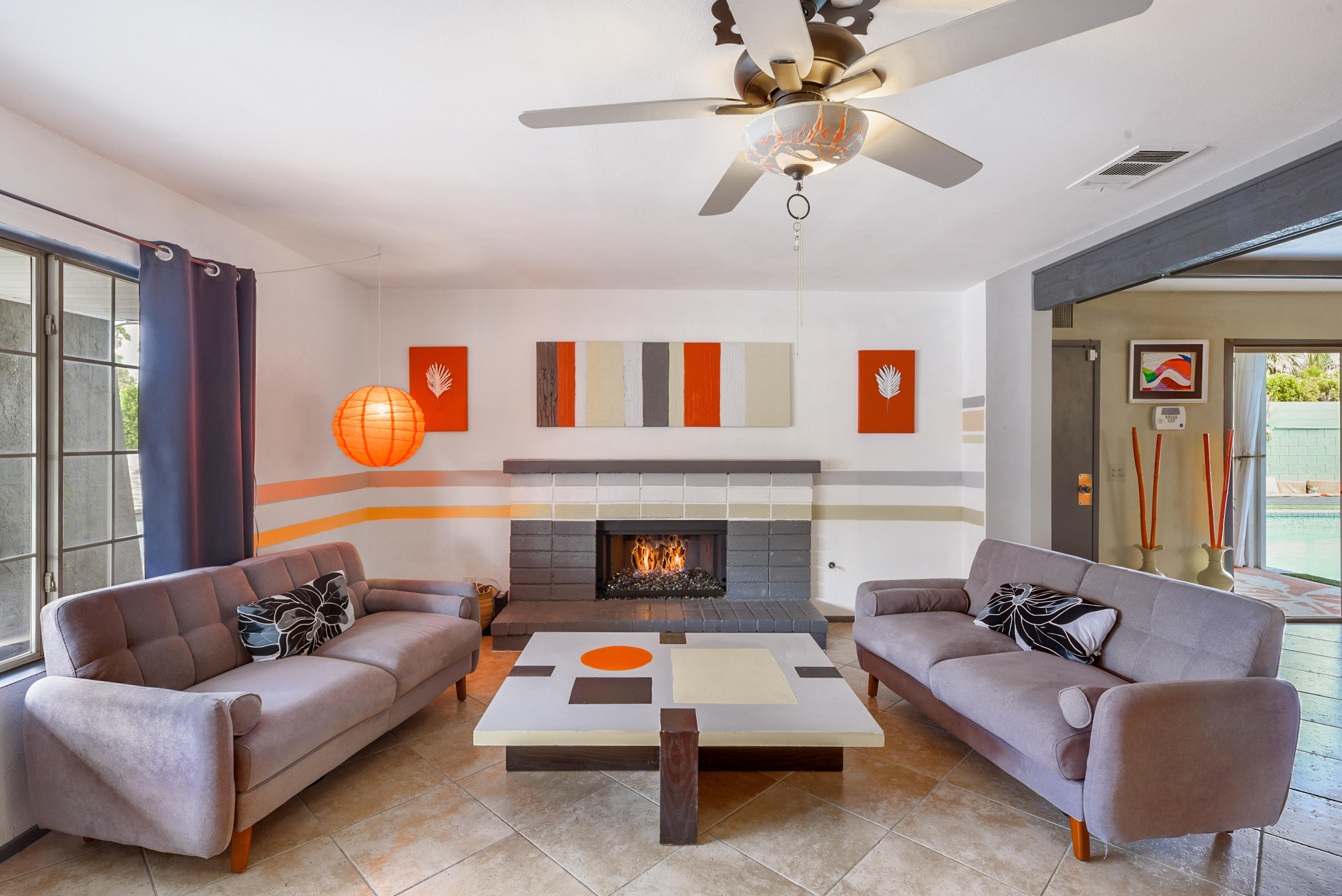 2306 Acacia Road East Palm Springs, CA 92262 - Photo 9 of 37 a living room with furniture and a fireplace