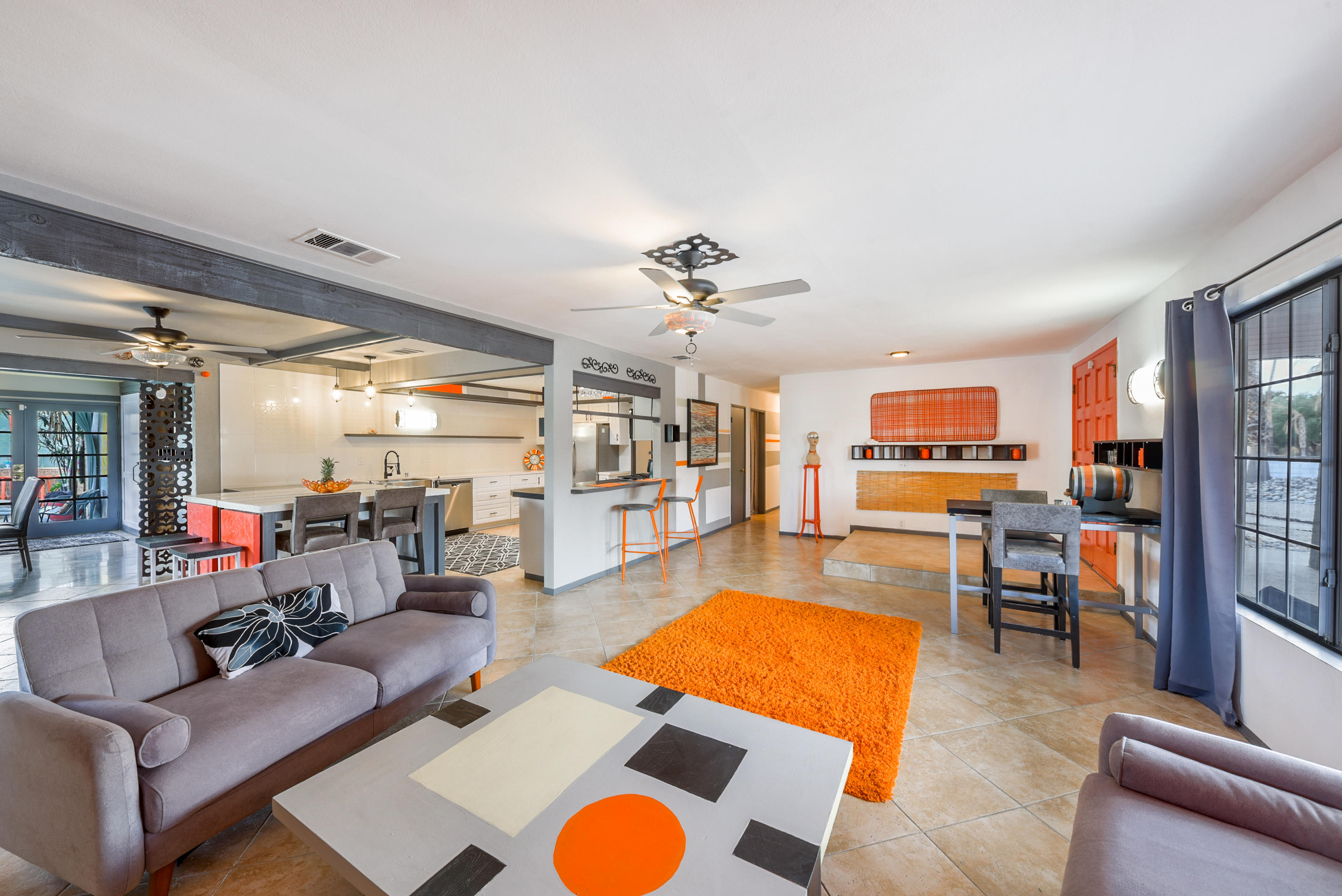 2306 Acacia Road East Palm Springs, CA 92262 - Photo 10 of 37 a living room with furniture kitchen view and a large window