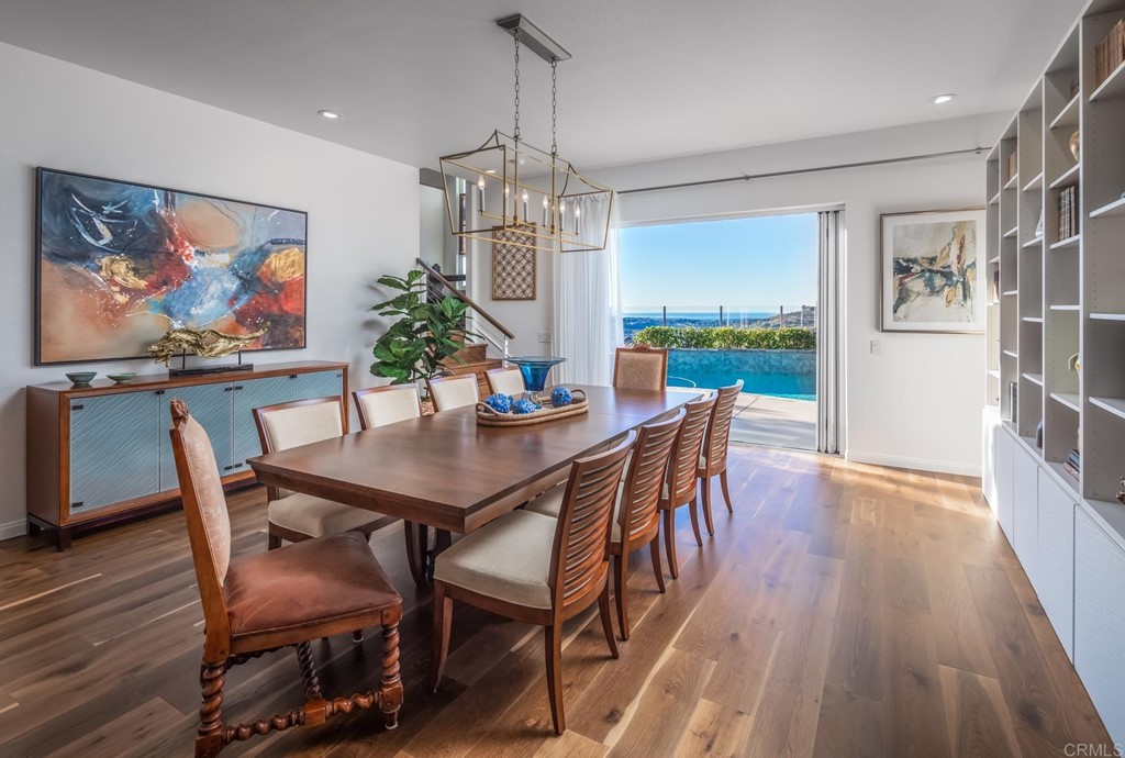 1464 Schoolhouse Way San Marcos, CA 92078 - Photo 14 of 48 a view of a dining room with furniture wooden floor and chandelier