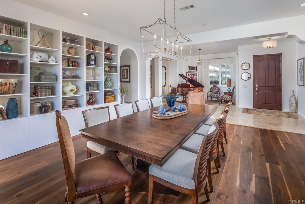 1464 Schoolhouse Way San Marcos, CA 92078 - Photo 15 of 48 a view of a dining room with furniture window and wooden floor