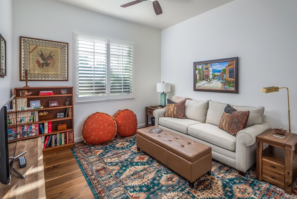 1464 Schoolhouse Way San Marcos, CA 92078 - Photo 29 of 48 a living room with furniture and a book shelf
