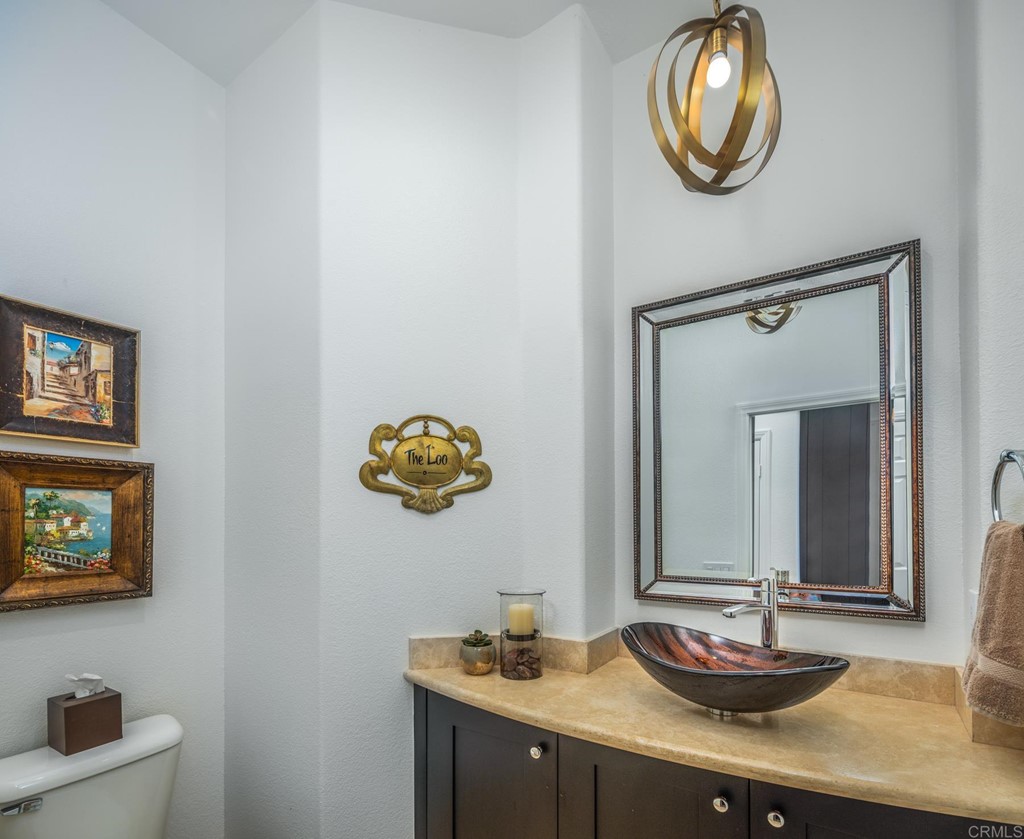 1464 Schoolhouse Way San Marcos, CA 92078 - Photo 30 of 48 a bathroom with a sink and a mirror