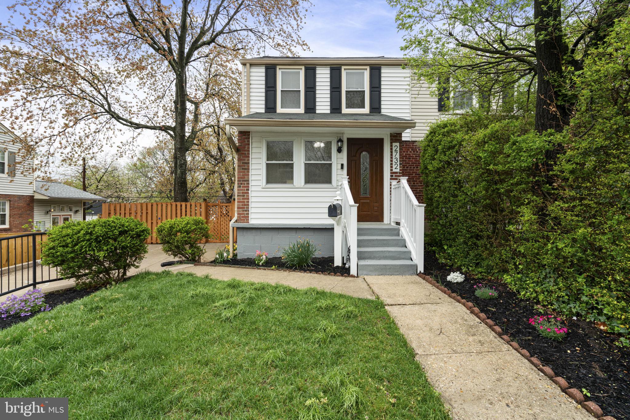 front view of a house with a yard