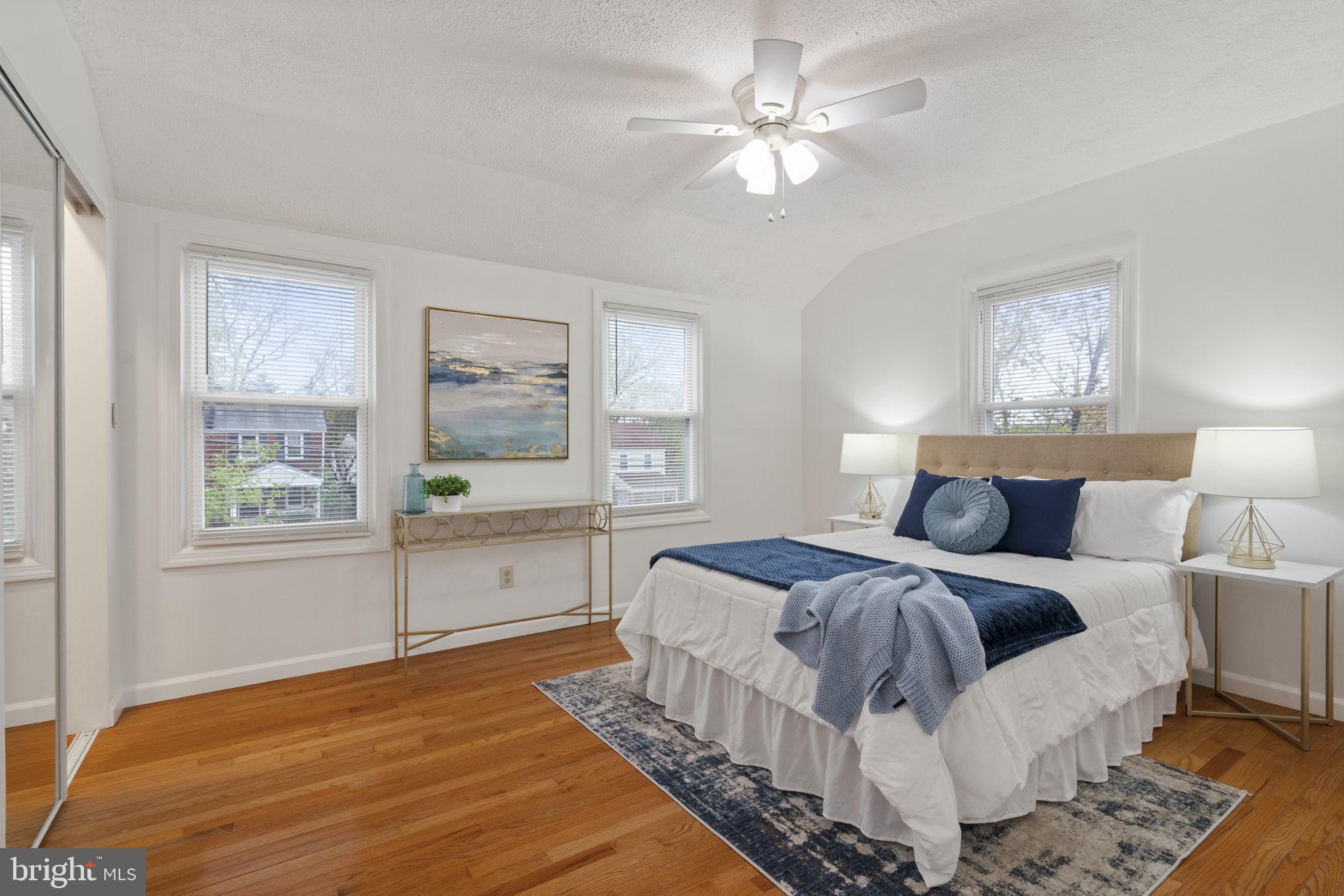 2732 Fort Drive Alexandria, VA 22303 - Photo 19 of 47 a spacious bedroom with a large bed a chandelier and windows