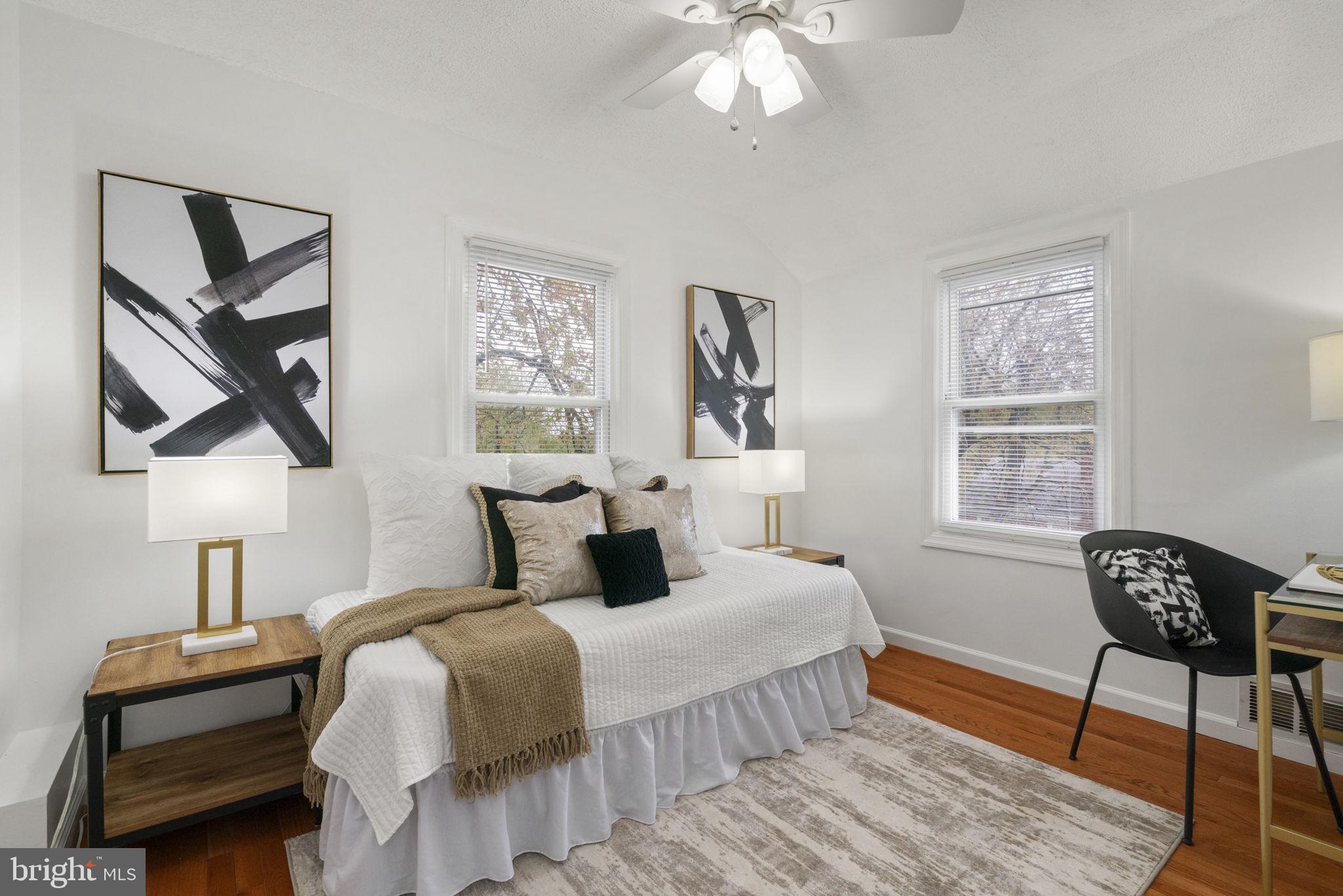 2732 Fort Drive Alexandria, VA 22303 - Photo 21 of 47 a bedroom with a bed and a chandelier