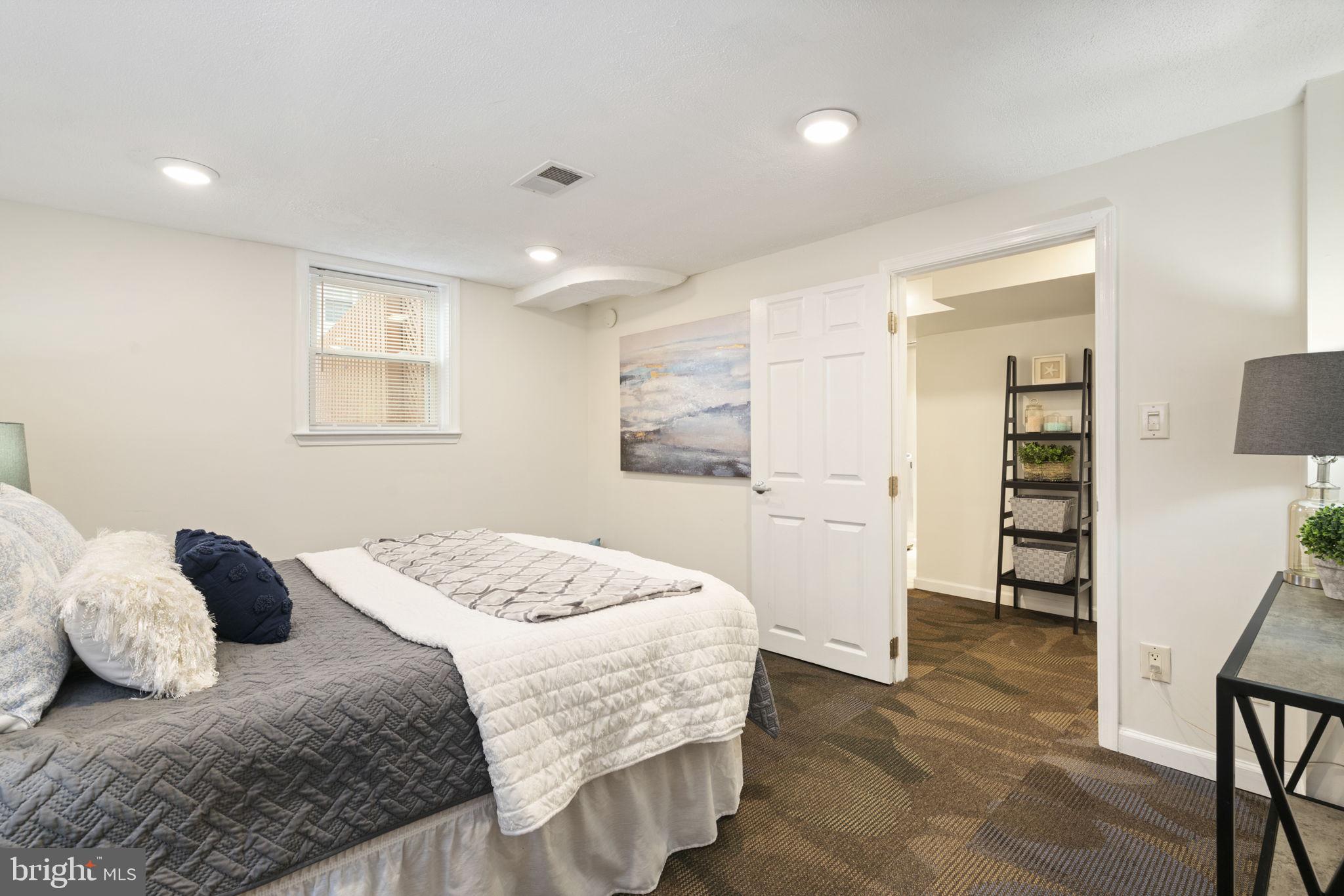2732 Fort Drive Alexandria, VA 22303 - Photo 27 of 47 a bedroom with a large bed and a wooden floor