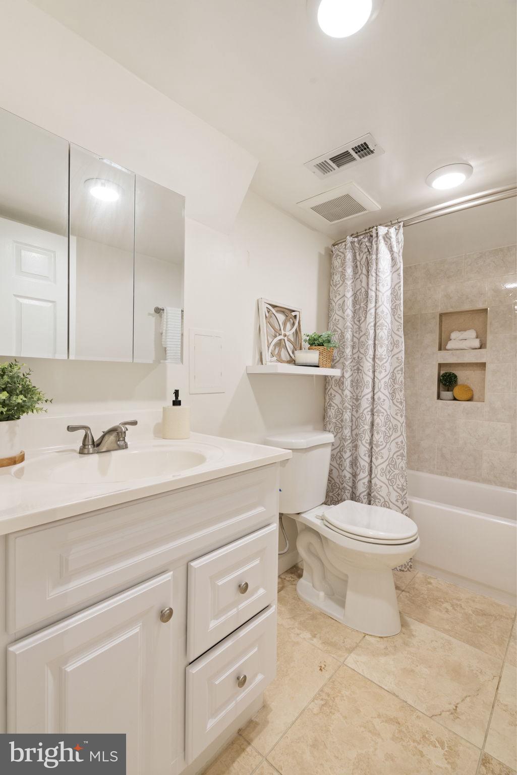 2732 Fort Drive Alexandria, VA 22303 - Photo 32 of 47 a bathroom with a sink a toilet and shower