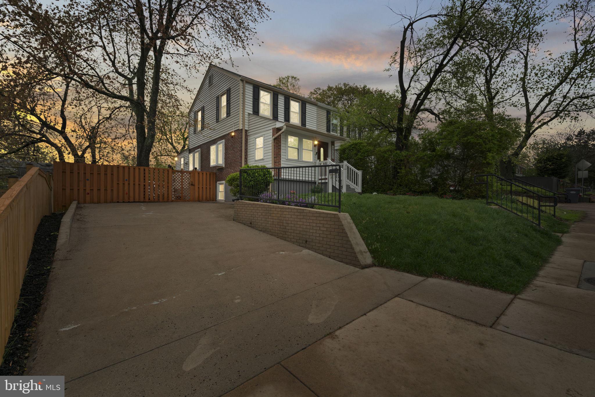 2732 Fort Drive Alexandria, VA 22303 - Photo 4 of 47 a front view of a house with a yard and garden