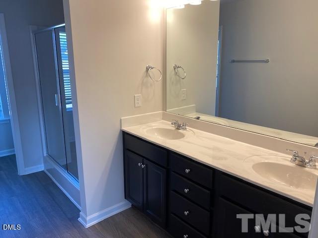 132 Montasel Court Fuquay-Varina, NC 27526 - Photo 11 of 20 a bathroom with a sink double vanity and a mirror