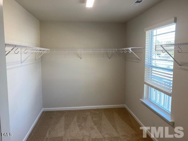 132 Montasel Court Fuquay-Varina, NC 27526 - Photo 13 of 20 a view of a room with racks on the wall