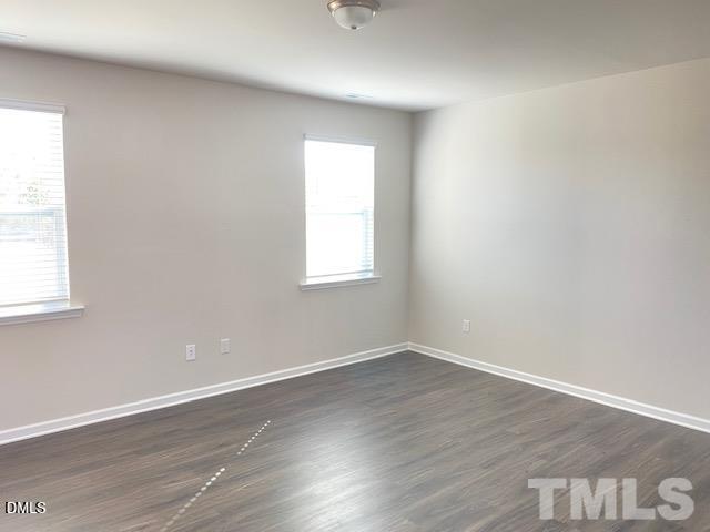 132 Montasel Court Fuquay-Varina, NC 27526 - Photo 3 of 20 an empty room with wooden floor and windows