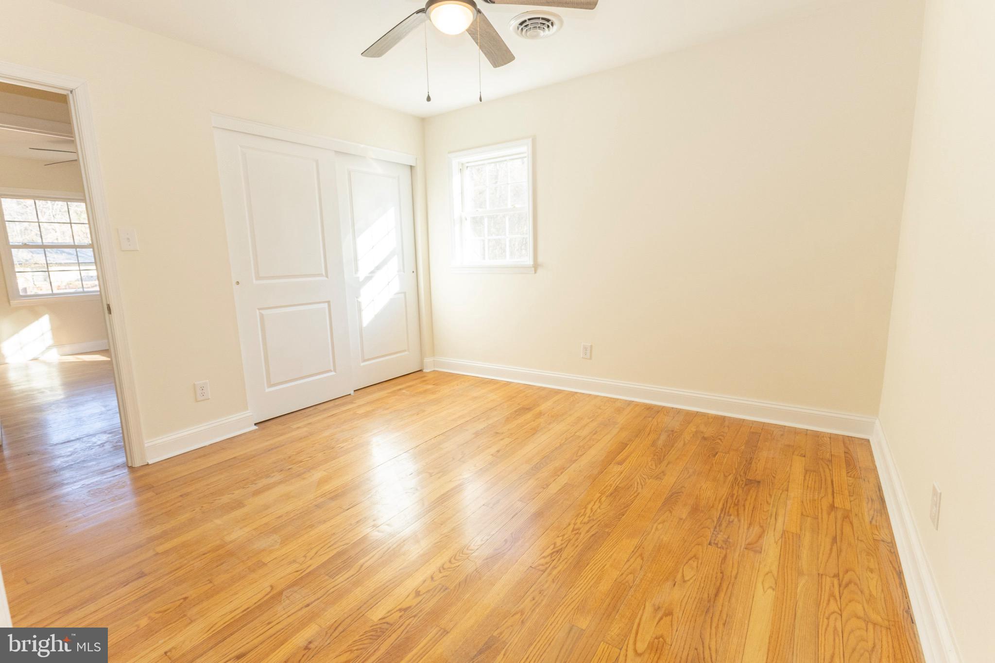 49151 Wynne Road Ridge, MD 20680 - Photo 48 of 80 Bright and airy bedroom with hardwood floors.