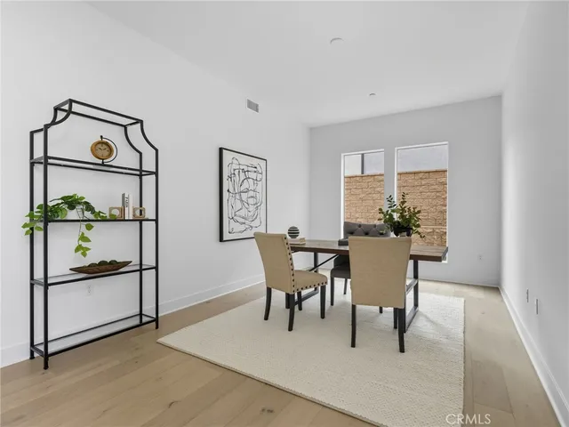 a view of a livingroom with furniture and a potted plant