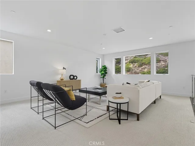 a living room with furniture and window
