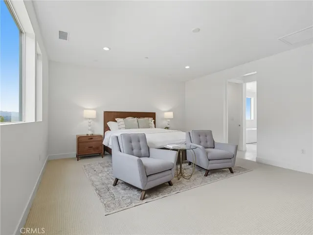 a bedroom with furniture and a couch