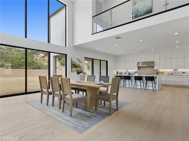 a dining room with furniture and wooden floor
