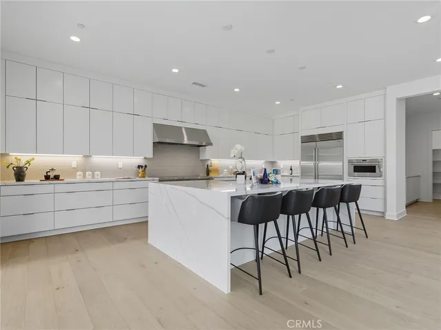 a kitchen with a table and chairs in it