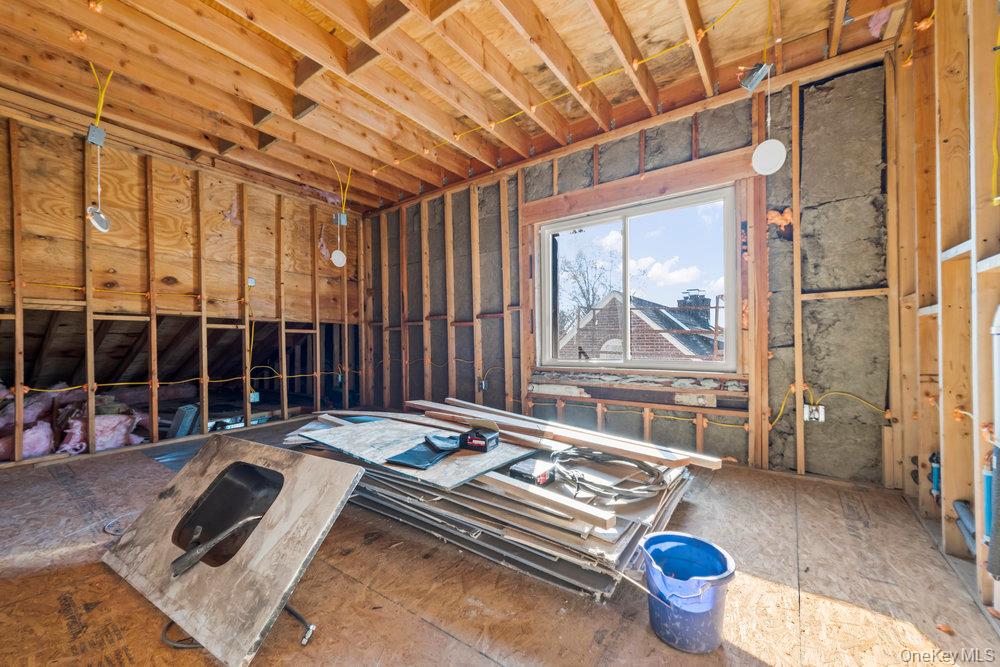 162 Old Mamaroneck Road White Plains, NY 10605 - Photo 3 of 22 a bed sitting in a room next to a window