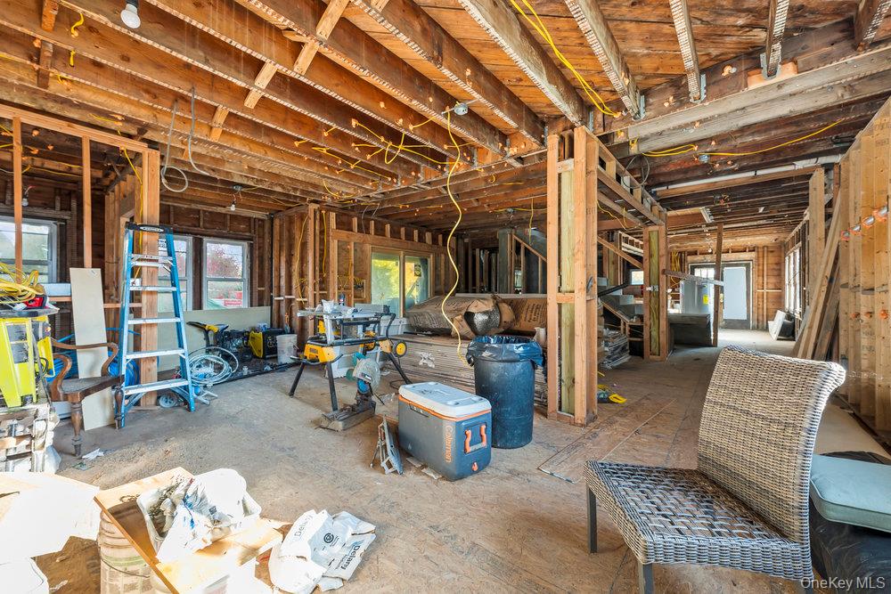 162 Old Mamaroneck Road White Plains, NY 10605 - Photo 5 of 22 a living room with furniture and a chandelier