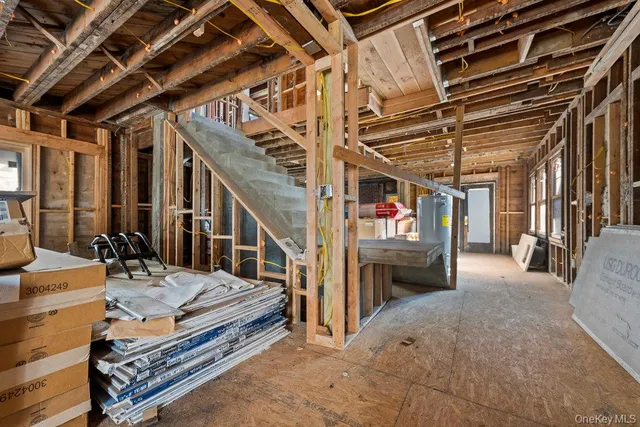 a view of a patio with table and chairs with wooden floor