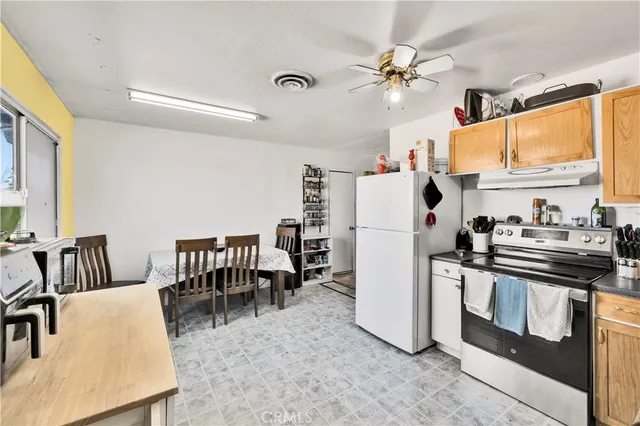 a view of living room with furniture and a window