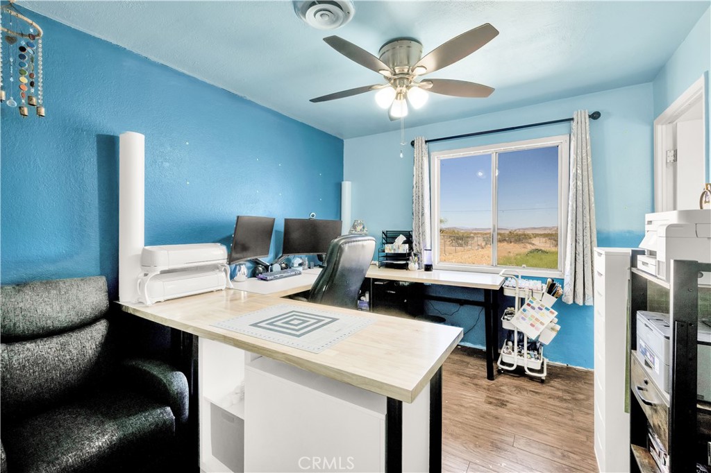 4805 Avenida La Mirada Joshua Tree, CA 92252 - Photo 14 of 38 a view of a dining room with a table and chairs