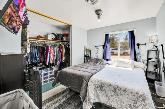 a view of a house with a yard and mountain view